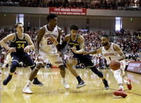 Mark Donnal (34) and D.J. Wilson (5)