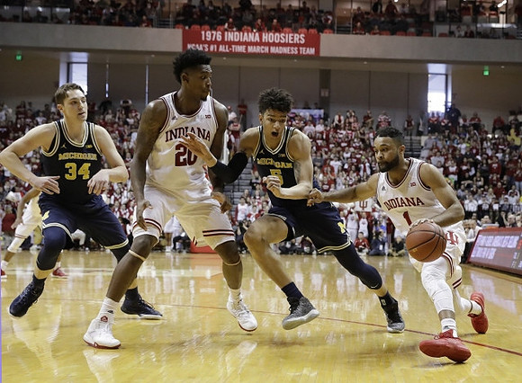 Mark Donnal (34) and D.J. Wilson (5)