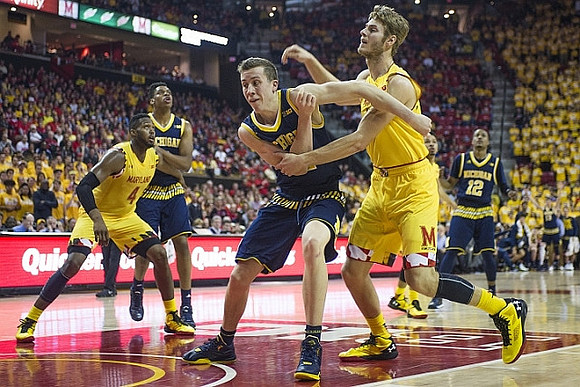 Kameron Chatman (3), Duncan Robinson (22), and Muhammad-Ali Abdur-Rahkman (12)