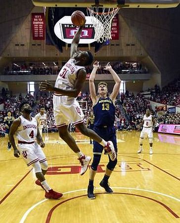 Moritz Wagner (13) and D.J. Wilson (5)