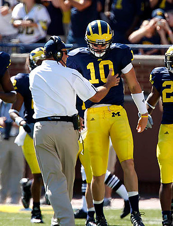 Rich Rodriguez and Steven Threet