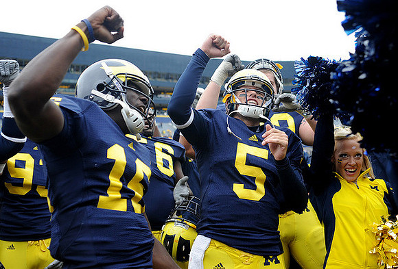 Denard Robinson (16) and Tate Forcier (5)