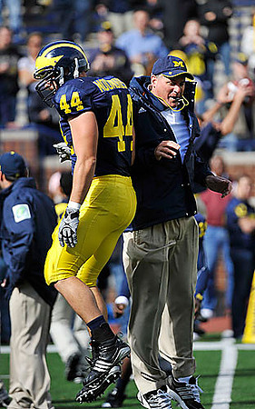 Mark Moundros (44) and Rich Rodriguez