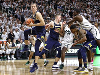 Duncan Robinson (22), Moritz Wagner (13), and Charles Matthews (1)