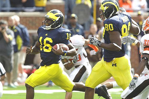 Denard Robinson (16) and Martell Webb (80)