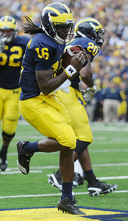 Stephen Schilling (52), Denard Robinson (16), and Michael Shaw (20)