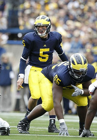 Tate Forcier (5) and Patrick Omameh (65)
