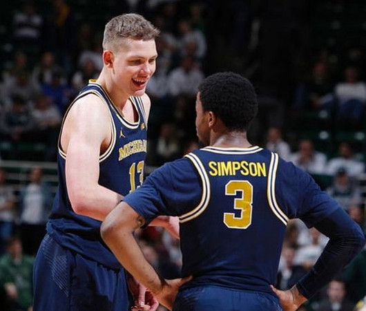 Moritz Wagner (13) and Zavier Simpson (3)