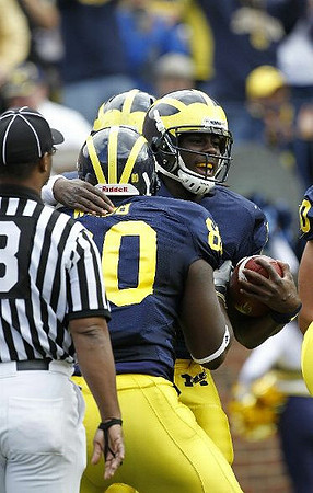 Denard Robinson (16) and Martell Webb (80)