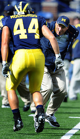 Mark Moundros (44) and Rich Rodriguez