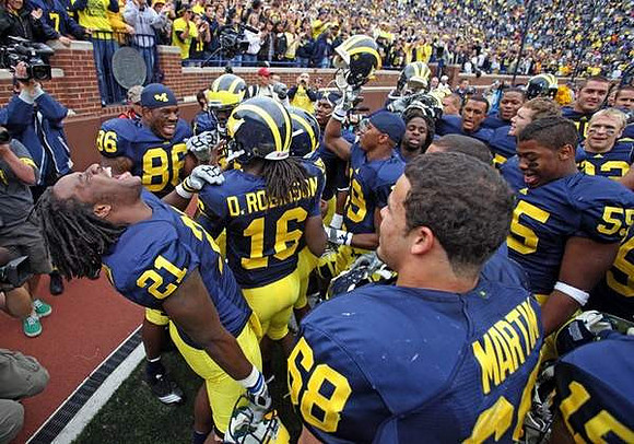 Kevin Koger (86), Junior Hemingway (21), Denard Robinson (16), Mike Martin (68), and Jibreel Black (55)