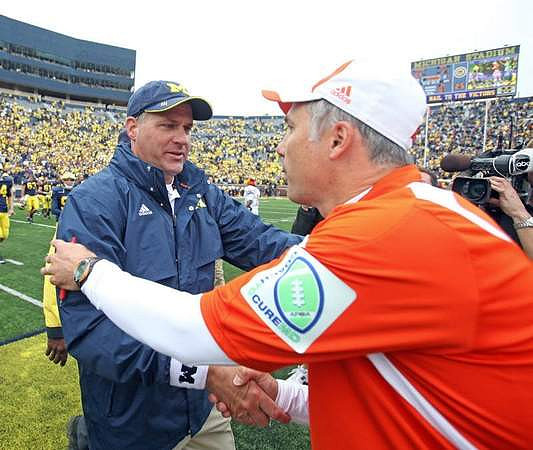 Rich Rodriguez and Dave Clawson