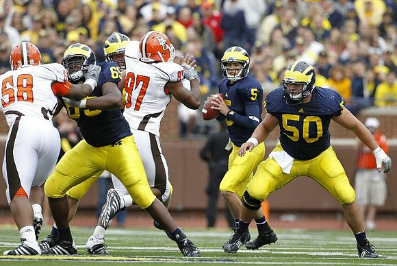 Patrick Omameh (65), Tate Forcier (5), and David Molk (50)