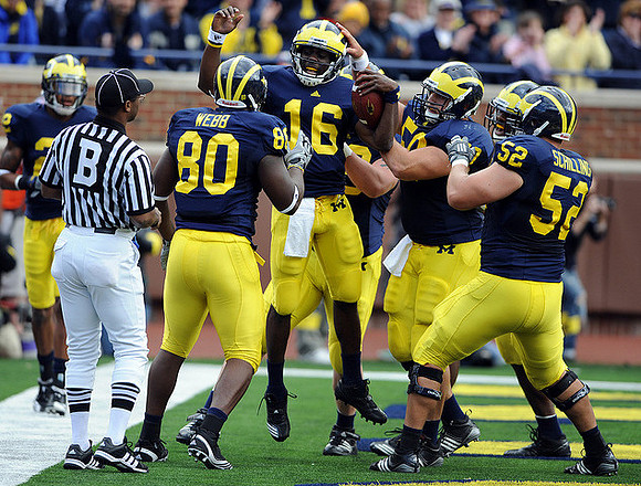 Martell Webb (80), Denard Robinson (16), David Molk (50), and Stephen Schilling (52)