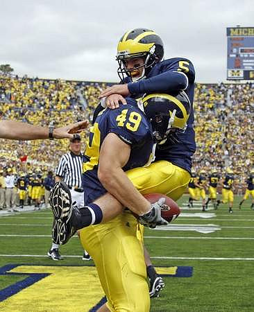 John McColgan (49) and Tate Forcier (5)