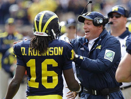 Denard Robinson (16) and Rich Rodriguez