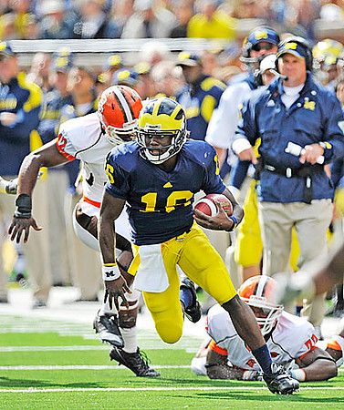 Denard Robinson (16) and Rich Rodriguez
