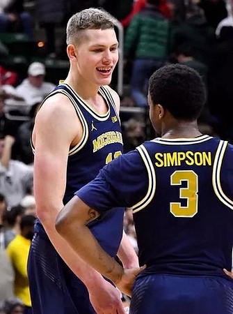 Moritz Wagner (13) and Zavier Simpson (3)