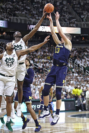 Isaiah Livers (4) and Moritz Wagner (13)