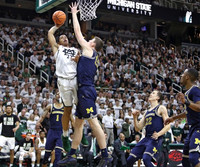 Charles Matthews (1), Jon Teske (15), Duncan Robinson (22), and Muhammad-Ali Abdur-Rahkman (12)