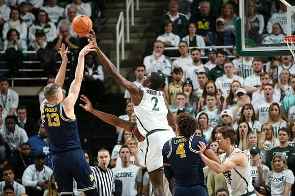 Moritz Wagner (13) and Isaiah Livers (4)
