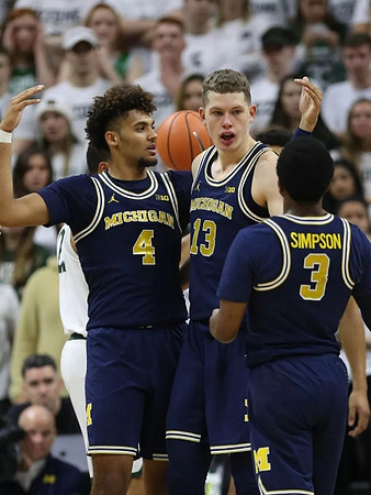 Isaiah Livers (4), Moritz Wagner (13), and Zavier Simpson (3)