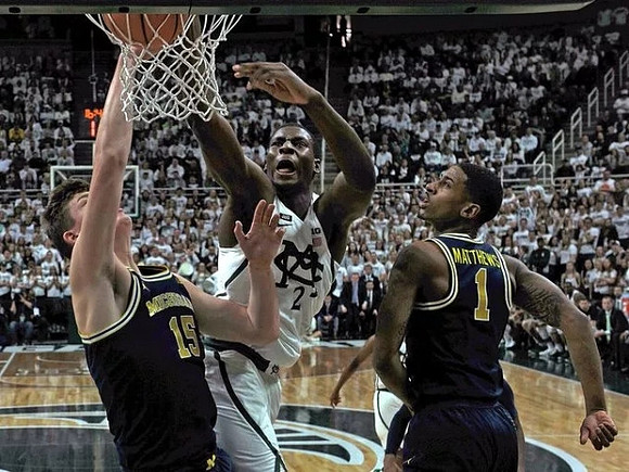 Jon Teske (15) and Charles Matthews (1)
