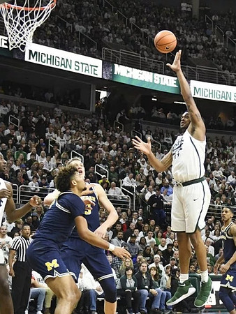 Isaiah Livers (4) and Moritz Wagner (13)