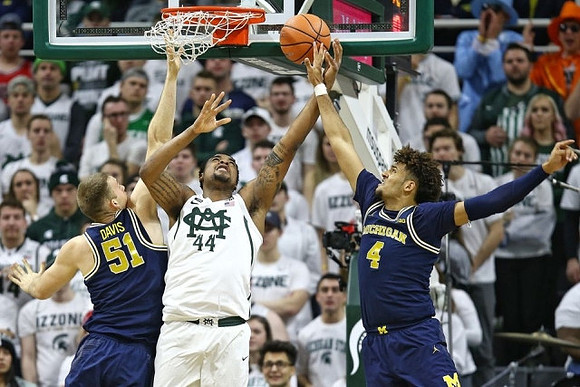 Austin Davis (51) and Isaiah Livers (4)