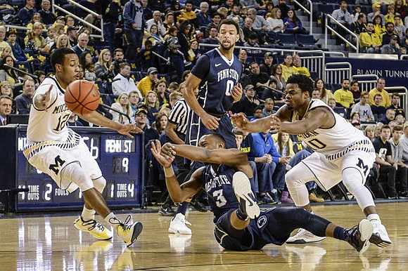 Muhammad-Ali Abdur-Rahkman (12) and Derrick Walton Jr. (10)