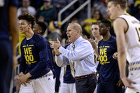 D.J. Wilson (5), John Beilein, Caris LeVert (23), and Moritz Wagner (13)
