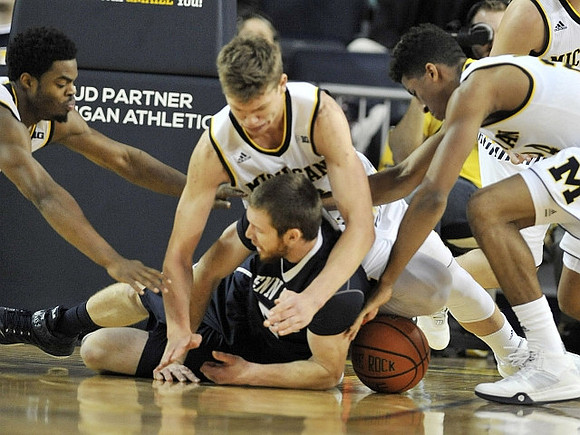 Derrick Walton Jr. (10), Moritz Wagner (13), and Aubrey Dawkins (24)
