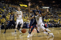 Mark Donnal (34) and Derrick Walton Jr. (10)