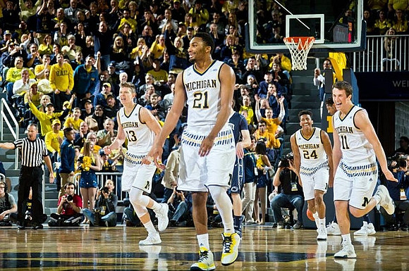Moritz Wagner (13), Zak Irvin (21), Aubrey Dawkins (24), and Andrew Dakich (11)