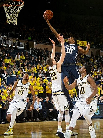 Zak Irvin (21), Duncan Robinson (22), and Derrick Walton Jr. (10)