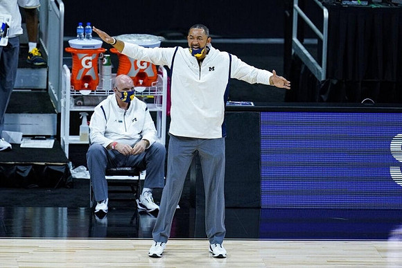 Juwan Howard and Phil Martelli