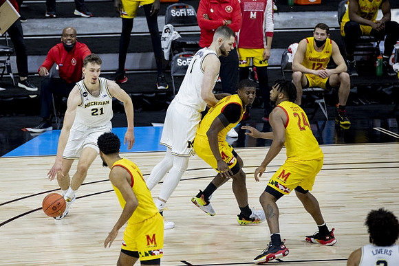 Franz Wagner (21), Hunter Dickinson (1), and Isaiah Livers (2)