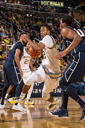 Zak Irvin (21) and Muhammad-Ali Abdur-Rahkman (12)
