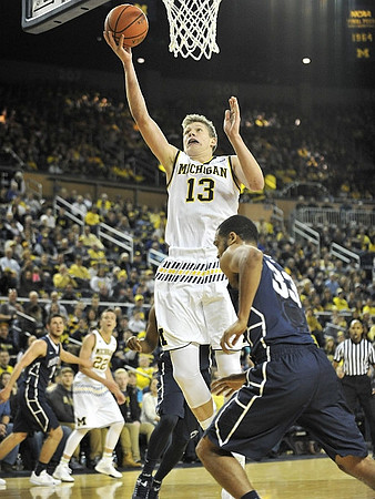 Duncan Robinson (22) and Moritz Wagner (13)