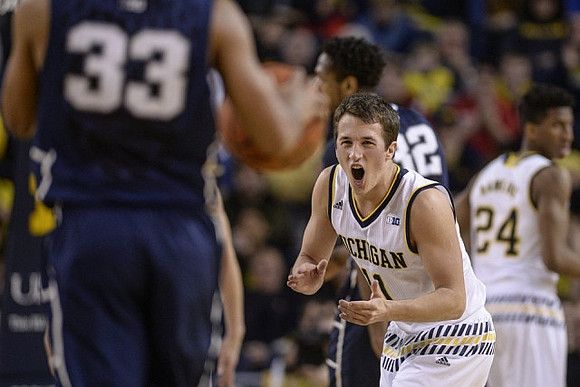 Andrew Dakich (11) and Aubrey Dawkins (24)