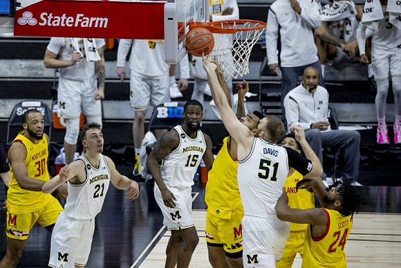 Franz Wagner (21), Chaundee Brown Jr. (15), and Austin Davis (51)