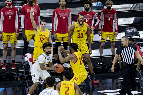 Mike Smith (12) and Brandon Johns Jr. (23)