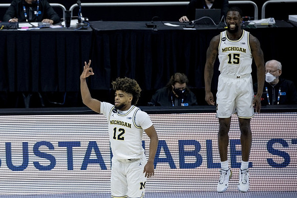 Mike Smith (12) and Chaundee Brown Jr. (15)