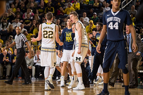 Duncan Robinson (22), D.J. Wilson (5), Moritz Wagner (13), Caris LeVert (23), and Jeff Meyer