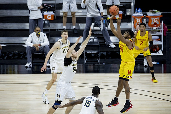 Franz Wagner (21), Austin Davis (51), and Chaundee Brown Jr. (15)