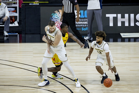 Hunter Dickinson (1) and Mike Smith (12)