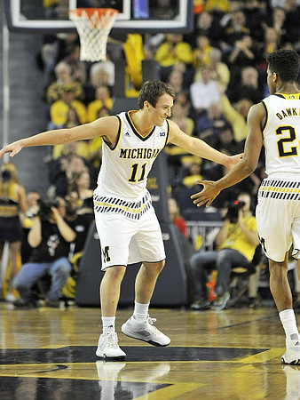 Andrew Dakich (11) and Aubrey Dawkins (24)