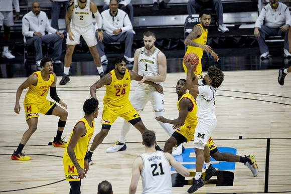Mike Smith (12), Hunter Dickinson (1), Franz Wagner (21), and Isaiah Livers (2)
