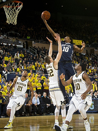 Zak Irvin (21), Duncan Robinson (22), and Derrick Walton Jr. (10)