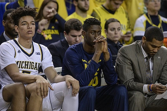 D.J. Wilson (5), Caris LeVert (23), and LaVall Jordan